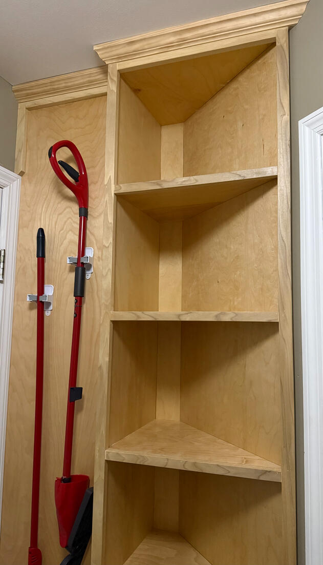 Same small laundry room - Small corner was previously unusable space, turned into extra shelving. Same small laundry room - Small corner was previously unusable space, turned into extra shelving.